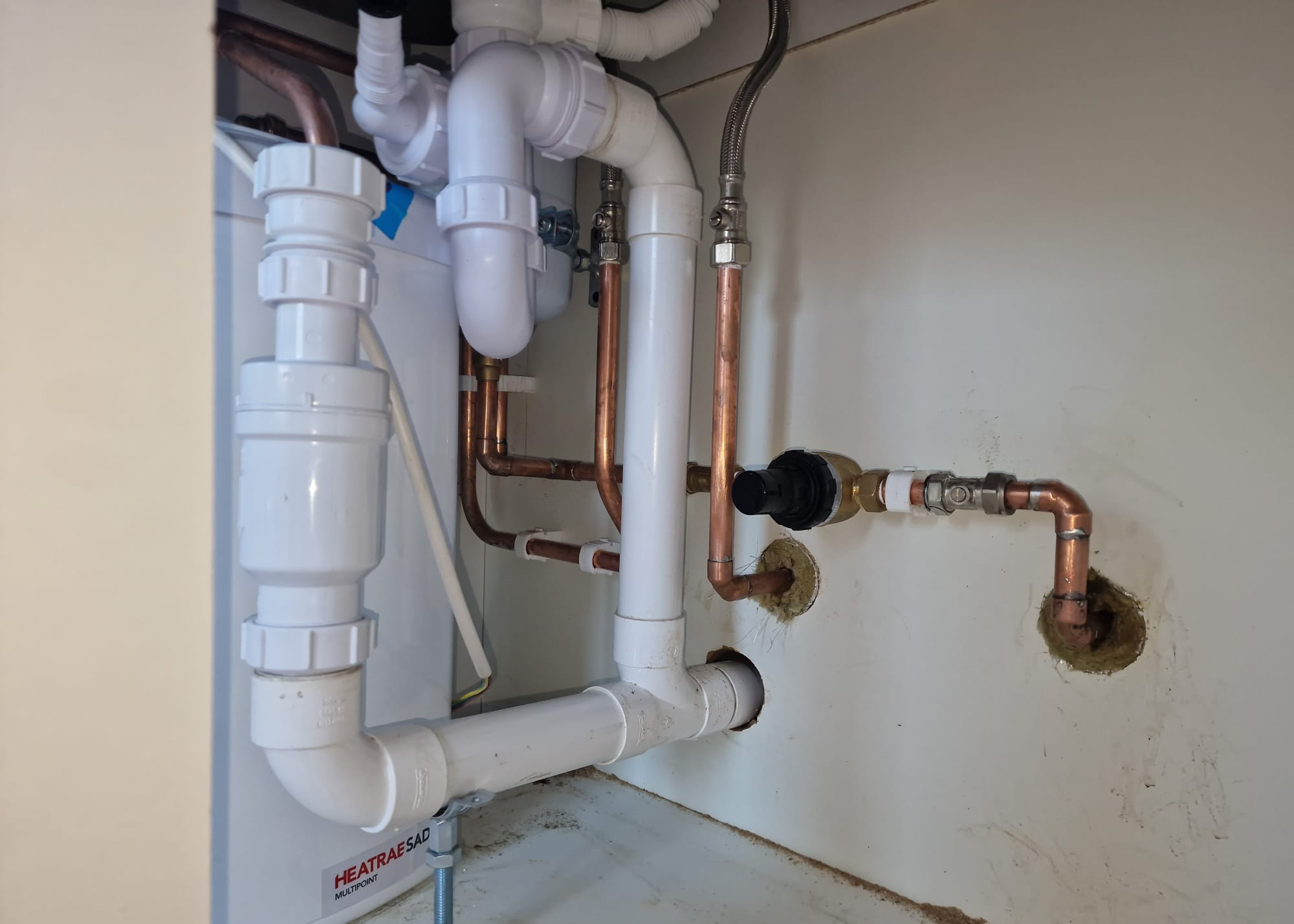 Under-counter water and waste pipework during installation