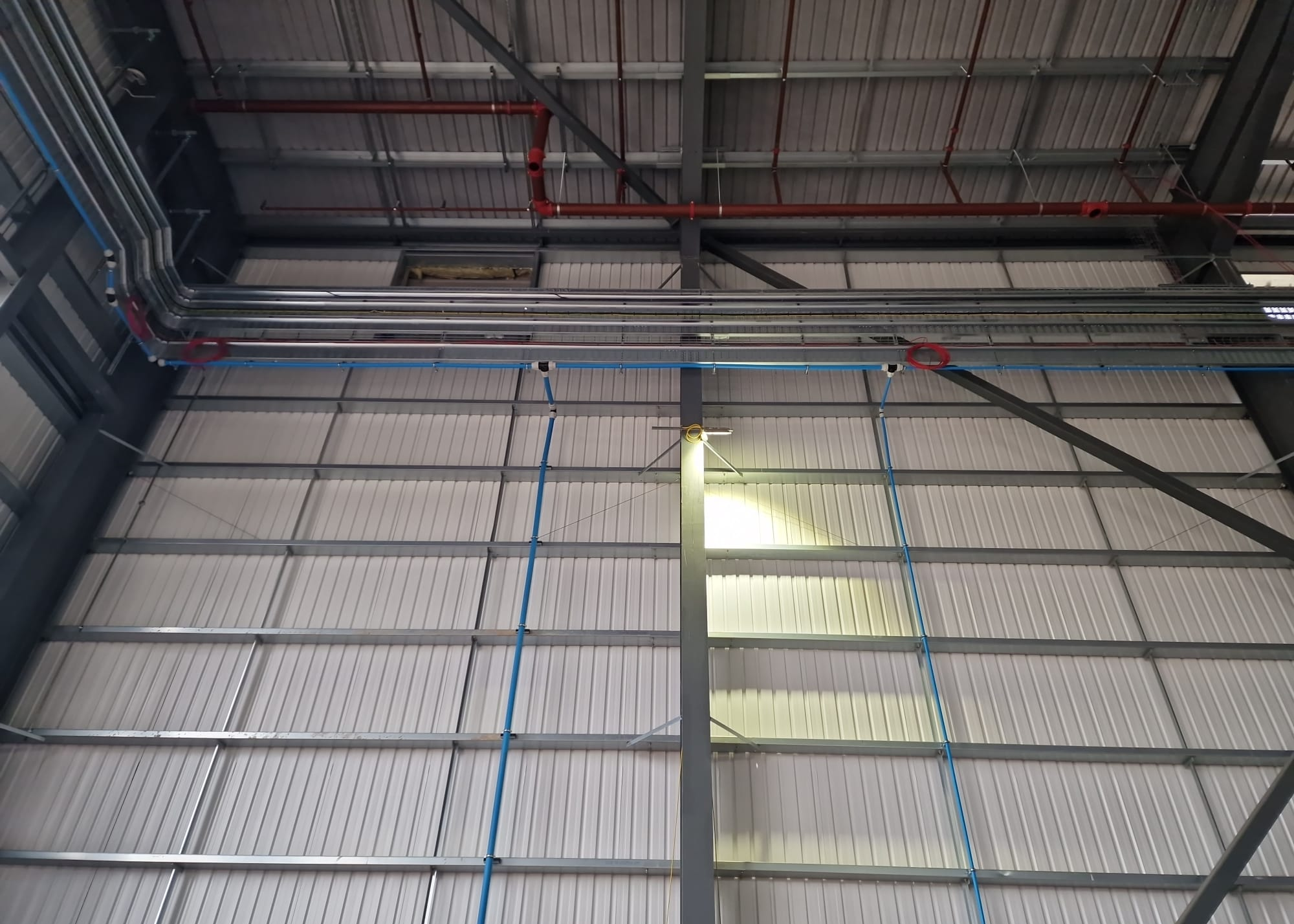 High-level MDPE distribution and vertical pipework in the main building