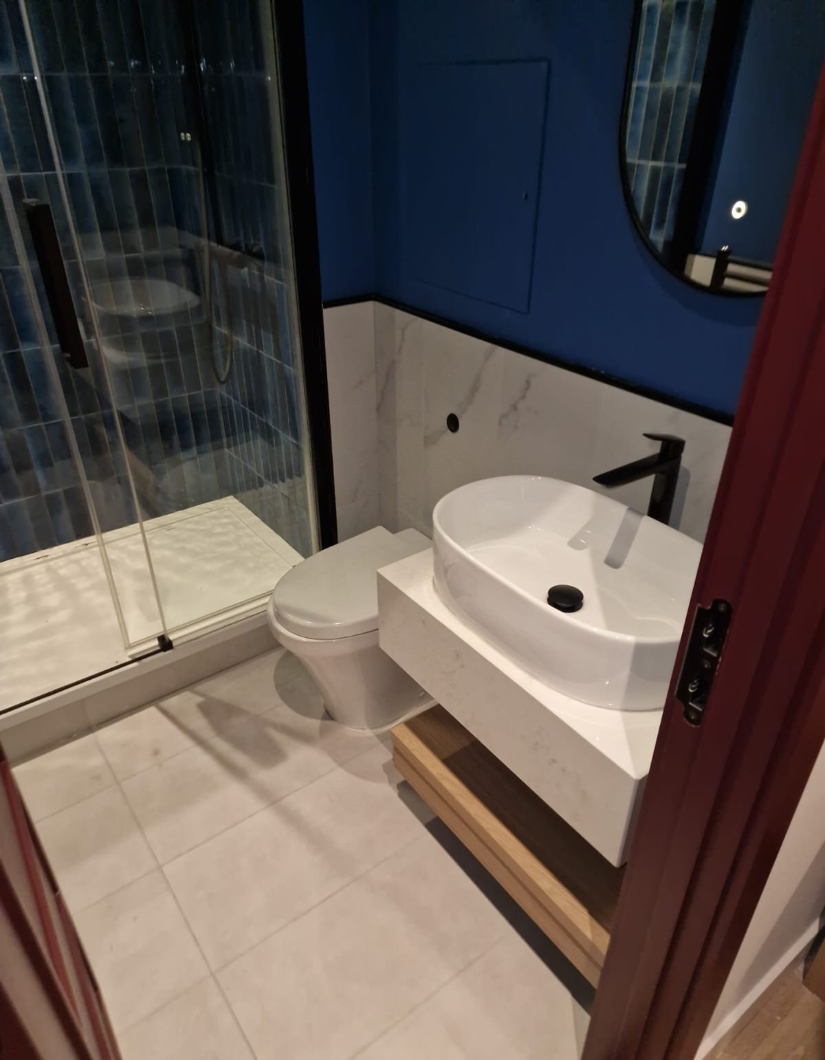 Bathroom with basin, WC and shower enclosure