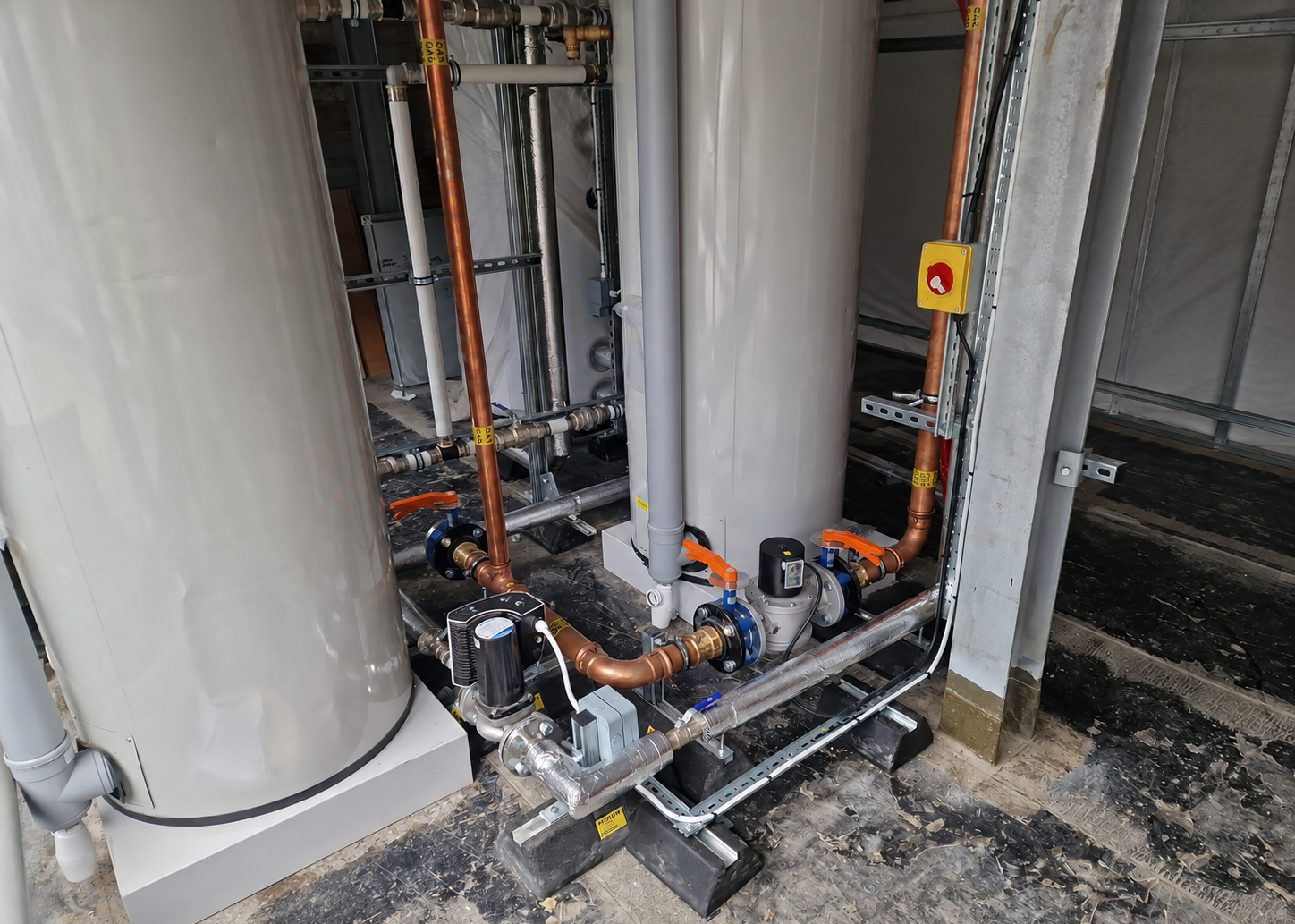 Water heaters with pipework and valves during installation