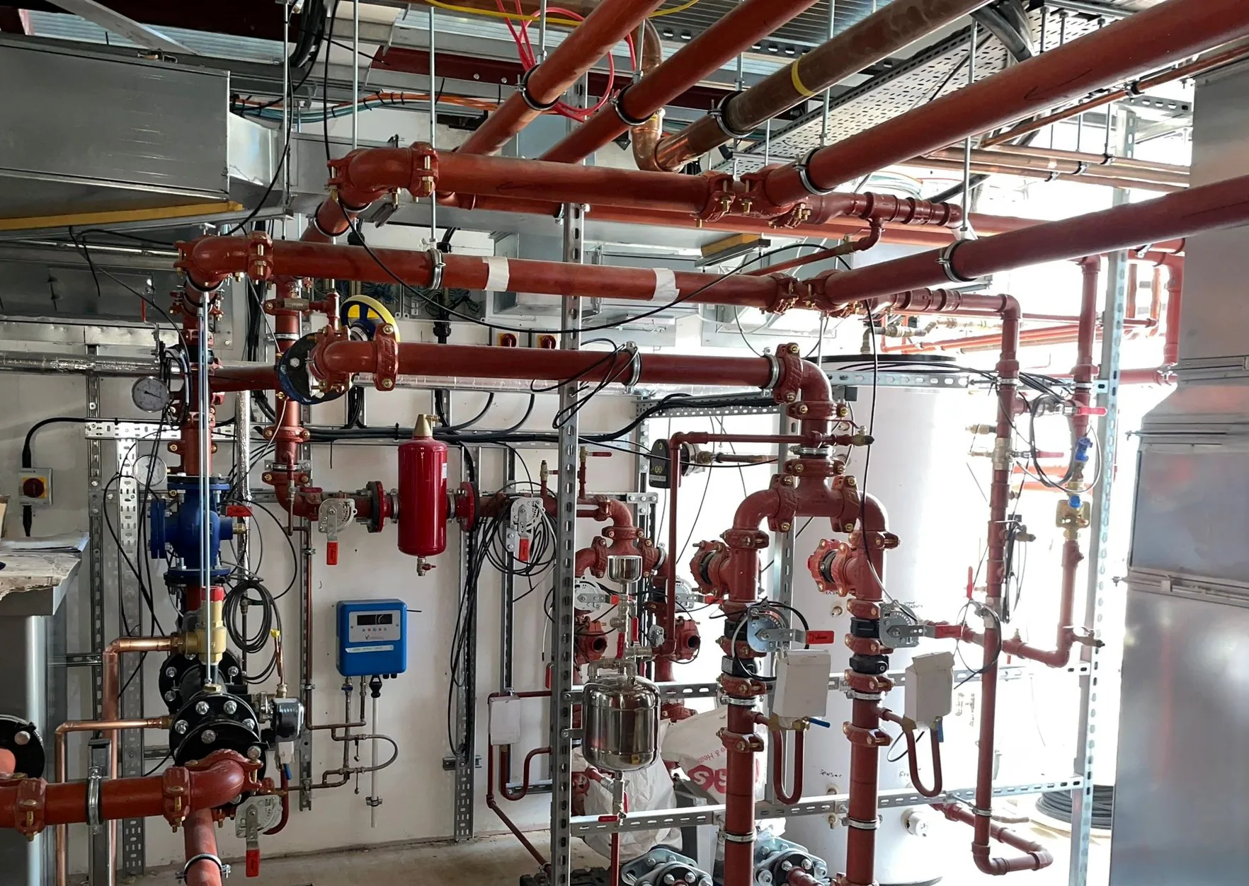 Plant room pipework, valves and equipment during installation