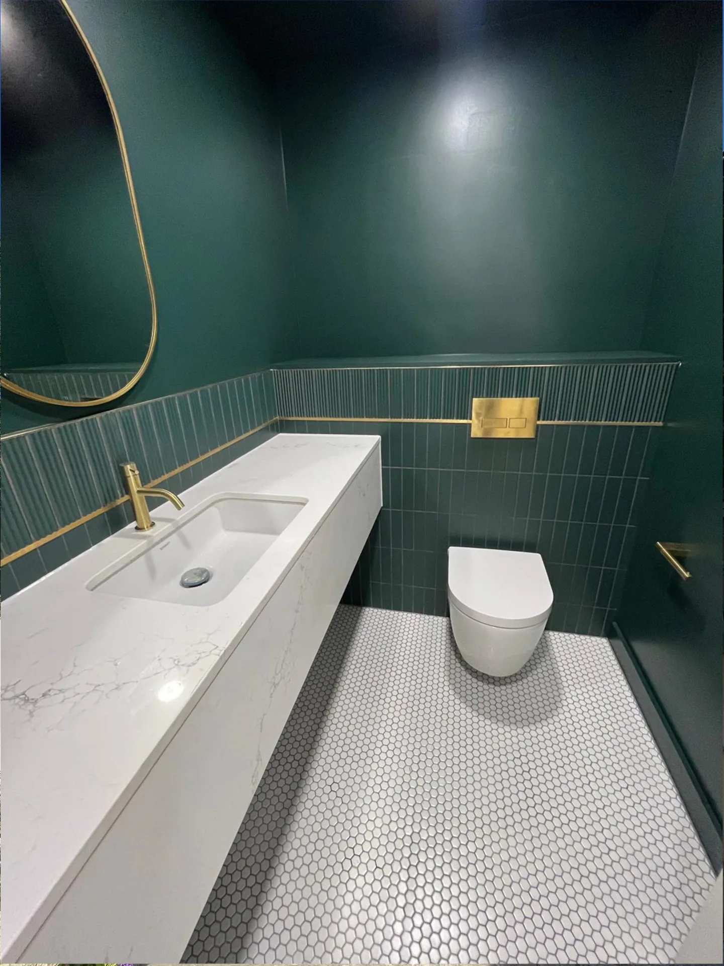 Washroom with a fitted basin, brass tap and WC at The New Timber Yard