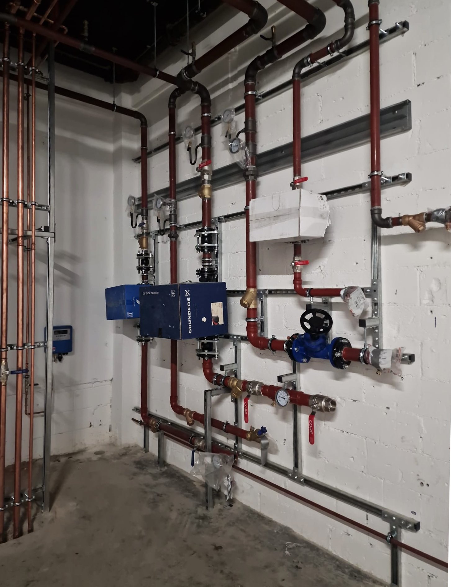 Plant room pipework, gauges and valves during installation